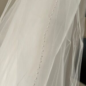 Cathedral length ivory bridal veil with beaded detail
